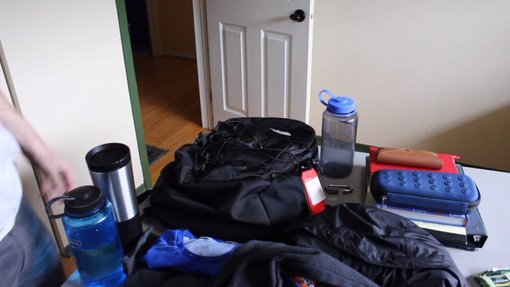 Filling North Face backpack with laptop and other items
